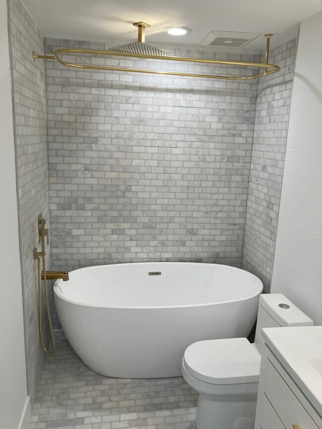 Self-standing tub with rain shower in main bath - 404 N 1060 W