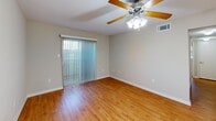 Located at 1309 Carrollton Ave in Metairie, Louisiana, this single-floor, 2-bedroom, 3-bathroom residence offers a practical and comfortable layout. The open-concept living, dining, and kitchen area forms the heart of the home, featuring warm hardwood-style flooring, a ceiling fan with light fixture, and sliding glass doors with vertical blinds that lead to a private patio. The kitchen is well-appointed with warm oak cabinetry, granite countertops, a tile backsplash, black appliances including a refrigerator, electric range with overhead microwave, and dishwasher, all arranged in an efficient galley-style configuration. The primary bedroom is generously sized, finished with plush carpet, a ceiling fan, and convenient access to its own bathroom featuring a wood-tone vanity with white countertop and a full tub/shower. The second bedroom is equally comfortable, also carpeted with a ceiling fan and natural light from a window. Four closets throughout the home provide ample storage. Three full bathrooms ensure convenience for residents and guests alike. A dedicated laundry area and hallway complete the thoughtfully organized floor plan, making this Metairie residence a well-rounded and functional home.
