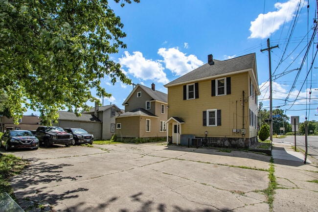 Back entrance and parking surface - 1403 S Burdick St