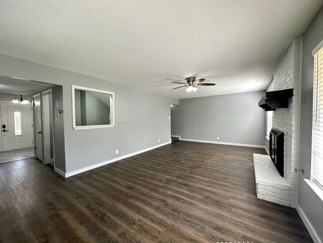 Building Photo - PRICE IMPROVEMENT! Stylish home with solar...