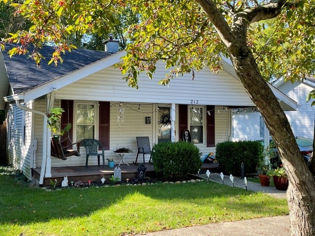 Quaint street, off street parking and cozy porch with swing. - 212 E Vermilya Ave