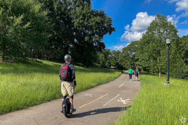 The Freedom Park Trail in Inman Park is designated for pedestrians to walk or scooter.
