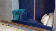 Located at 60 Minorca Ave in the heart of Coral Gables, Florida, this elegantly designed amenity floor offers a comprehensive collection of social and functional spaces. The welcoming lobby sets the tone with large-format cream tile flooring, textured chevron-patterned accent walls in deep slate blue, and curated seating arrangements that blend contemporary and mid-century modern aesthetics.

The living lounge features plush, jewel-toned furnishings, a large flat-screen television, and bold artwork, creating an inviting space for relaxation and entertainment. Adjacent to the lounge, a dedicated game room provides a full-size billiard table beneath a warm wood tray ceiling with designer globe pendant lighting, alongside a shuffleboard table set against built-in banquette seating with views of the surrounding cityscape through floor-to-ceiling windows.

The conference room is appointed with a substantial white marble-top table, upholstered seating for eight, a large wall-mounted display screen, and botanical accents — ideal for professional meetings. A compact business center rounds out the offering with dual workstations and ergonomic seating in a focused, quietly styled environment. Together, these spaces deliver a polished, amenity-rich experience suited for both productivity and leisure.