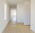 This contemporary single-story residence in New Caney, TX offers 1,480 square feet of well-designed living space. The home features four bedrooms, including a 160 sq ft primary suite, and three full bathrooms. The interior boasts a neutral color palette with crisp white walls and a mix of carpeted and light wood-tone flooring, creating a bright and airy atmosphere throughout.

The heart of the home is a modern kitchen equipped with white cabinetry, stainless steel appliances, and a convenient breakfast bar. The open-concept layout seamlessly connects the kitchen to a spacious living area, ideal for both everyday living and entertaining. Large windows in the main living space provide ample natural light and views of the surroundings.

The bedrooms are generously sized, with the primary bedroom offering a private en-suite bathroom. The bathrooms feature clean lines with white vanities and modern fixtures. A stand-alone shower with built-in shelving adds a touch of luxury to one of the bathrooms.

Additional amenities include an attached garage, multiple closets for storage, and a ceiling fan in the main living area for comfort. The property's exterior showcases a simple yet attractive facade with a pitched roof, complemented by a neatly maintained yard.