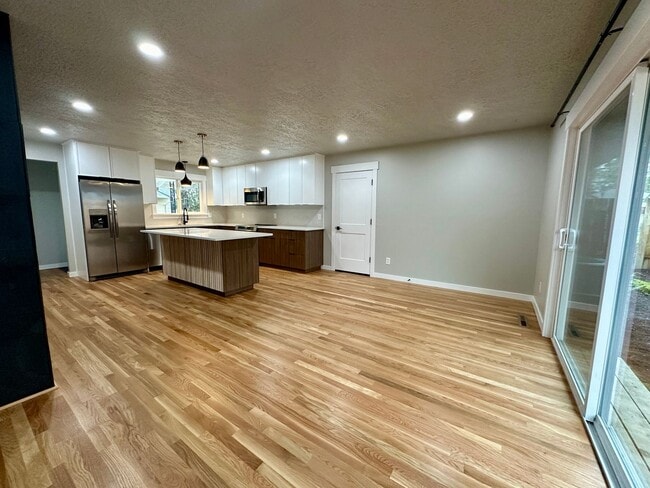 Building Photo - 1/2 Month Free! Sun-Filled 3-Bedroom Ranch with Wood Flooring, A/C, Updated Kitchen & 2-Car Garage!