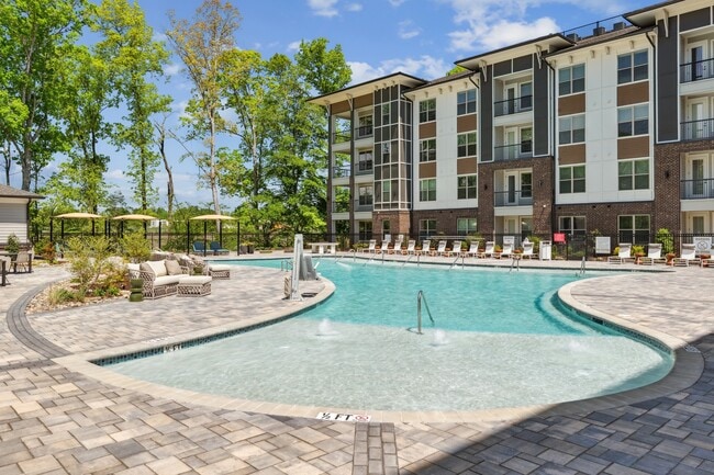 Salt-Water Pool - Resort-style pool with sun shelf, cabanas and grills for relaxing and entertaining close to home. - Linz Charlotte
