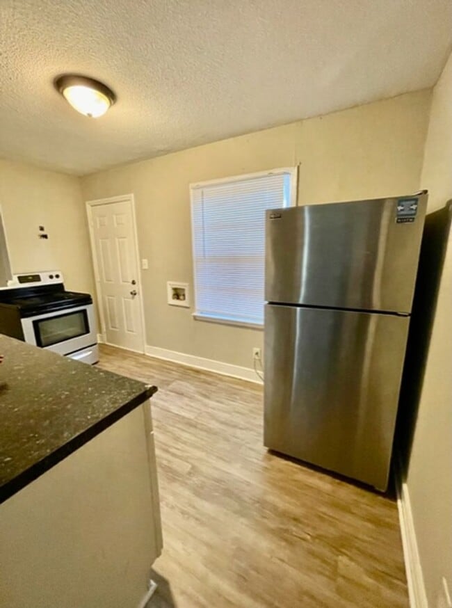 Building Photo - This cozy 2 bed 1 bath cottage style brick home is located on a corner lot of E 17th St and N McD...