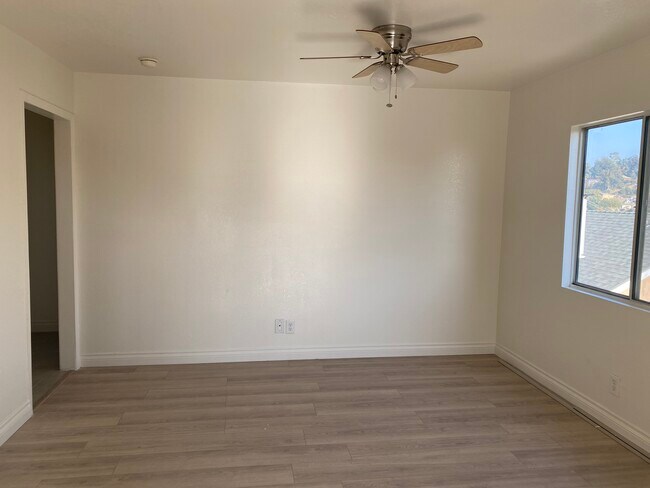 Large living room with NEW ceiling fan - 4400 Tourmaline St