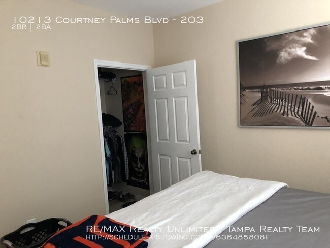 Building Photo - 10213 Courtney Palms BLvd #203