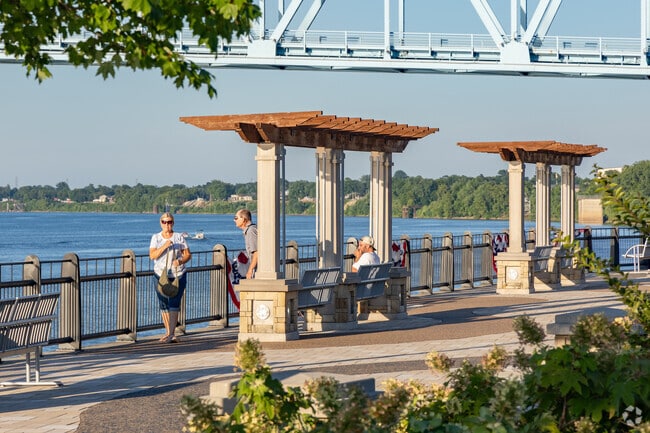 Residents enjoy a lazy swing while overlooking the Ohio River.