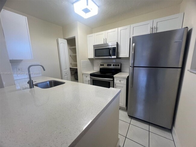 Building Photo - 6560 W 27th Ct
