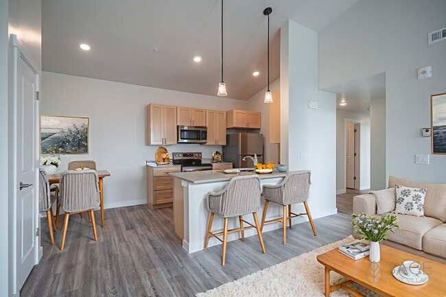 Sage Point Village Apartments - Staged Photo of Living Room, Dining Room and Kitchen - Sage Point Village