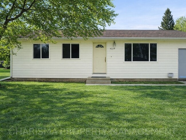 Building Photo - 4 BD, 2 BA - FENCED IN YARD, PRIVATE TRAILS, FINISHED UPPER AND LOWER LIVING AREAS, ATTACHED GARAGE!