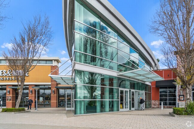The modern architecture of Tanforan Mall enhances the shopping experience near Mills Park.