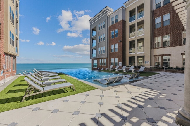 Oceanfront resort-style pool at The Alexa Luxury Apartments in Corpus Christi, TX. - The Alexa Luxury Apartments I & II