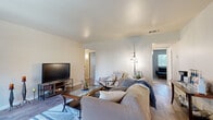 Located at 1420 F Street in Davis, CA, this single-story unit offers three bedrooms and two bathrooms across a well-utilized floor plan. The living room serves as the heart of the home, featuring wood-style flooring, neutral walls, and a sliding glass door that opens onto a private balcony with outdoor views — filling the space with natural light. The adjacent dining area is a cozy nook framed by windows with slatted blinds and topped with a classic pendant light fixture, creating an intimate setting for meals. The kitchen is outfitted with white raised-panel cabinetry, granite-style countertops, a stainless steel dishwasher, and ample counter space, offering both functionality and a clean aesthetic. The bedrooms are carpeted for comfort, with the secondary bedrooms featuring bright windows that invite natural light. The bathrooms are finished in a crisp white palette, with one featuring a full tub-shower combination, a white vanity, and a small window for ventilation. Hallways and closets provide practical storage throughout. The overall ambiance is clean, light, and functional — well-suited for everyday living in a convenient Davis location.