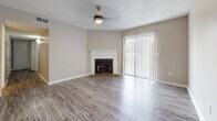 Located at 325 Longmeadow Dr in Ridgeland, MS, this single-story, 4-bedroom, 2-bathroom home offers a functional and comfortable layout across one level. The living room serves as the heart of the home, showcasing light wood-look flooring, a textured ceiling, a ceiling fan, and a classic brick fireplace with a white mantel. Large vertical-blind-covered sliding doors allow natural light to fill the space, creating a bright and welcoming atmosphere. The kitchen is well-appointed with gray cabinetry, light countertops, a stainless steel double-basin sink, a stainless steel dishwasher, and an elegant chandelier overhead, with matching wood-look flooring that continues from the main living areas. The four bedrooms are carpeted for comfort, each featuring neutral tones, white bifold closet doors, and ceiling fans. A hallway connects the bedrooms to the two bathrooms, one of which includes a dark-cabinet vanity with marble-style countertop, wood-look flooring, and a full bathtub with tiled surround. A dedicated closet provides additional storage. The home's cohesive neutral color palette and updated finishes throughout make it a move-in ready residence in a convenient Ridgeland location.