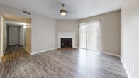 Located at 325 Longmeadow Dr in Ridgeland, MS, this single-story, 4-bedroom, 2-bathroom home offers a functional and comfortable layout across one level. The living room serves as the heart of the home, showcasing light wood-look flooring, a textured ceiling, a ceiling fan, and a classic brick fireplace with a white mantel. Large vertical-blind-covered sliding doors allow natural light to fill the space, creating a bright and welcoming atmosphere. The kitchen is well-appointed with gray cabinetry, light countertops, a stainless steel double-basin sink, a stainless steel dishwasher, and an elegant chandelier overhead, with matching wood-look flooring that continues from the main living areas. The four bedrooms are carpeted for comfort, each featuring neutral tones, white bifold closet doors, and ceiling fans. A hallway connects the bedrooms to the two bathrooms, one of which includes a dark-cabinet vanity with marble-style countertop, wood-look flooring, and a full bathtub with tiled surround. A dedicated closet provides additional storage. The home's cohesive neutral color palette and updated finishes throughout make it a move-in ready residence in a convenient Ridgeland location.