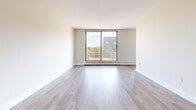 Located at 1134 Adelaide St N in London, Ontario, this one-bedroom, one-bathroom unit offers a functional and well-designed floor plan with a clean, modern aesthetic throughout. Light-toned laminate flooring runs continuously across the living spaces, lending a cohesive and bright feel to the interior.

The entrance leads into a thoughtfully arranged layout that separates the living and sleeping areas. The galley-style kitchen features white cabinetry, dark countertops, a subway tile backsplash, stainless steel appliances, and a double sink — offering both style and practicality. Adjacent to the kitchen is a dedicated dining area, which flows naturally into the spacious living room. A large sliding glass door in the living room fills the space with natural light and provides direct access to a private balcony with outdoor views.

The generously sized primary bedroom includes a closet and is bathed in natural light from a large window. Three closets are distributed throughout the unit, providing ample storage. The bathroom is finished with classic white subway tile surrounding a full soaker tub, complemented by chrome fixtures for a clean, timeless look.

With a neutral colour palette, updated finishes, and a practical room arrangement, this unit delivers a comfortable and move-in-ready living space.