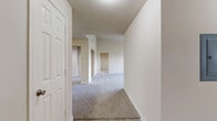 Located in Sugar Land, TX, this single-story, 2-bedroom, 2-bathroom home offers a well-organized layout designed for comfortable everyday living. The interior features a neutral color palette with warm beige walls and plush carpet throughout the main living and bedroom areas, while the bathrooms and laundry room feature light wood-look hard flooring. The open living area is generously sized, enhanced by a ceiling fan and access to a hallway leading to the front entry. The kitchen includes wooden cabinetry and connects to a dining room and a dedicated pantry for added storage convenience. Both bedrooms are carpeted and equipped with ceiling fans and natural light from windows. The spacious primary bedroom includes its own closet access. The bathrooms feature wood-toned vanity cabinetry with stone-look countertops. A dedicated office provides a functional workspace, while the full laundry room accommodates a washer and dryer side by side with overhead shelving. Five closets throughout the home provide exceptional storage capacity. A textured ceiling finish is consistent throughout the space. The home also includes a patio, offering an outdoor area for relaxation. This well-appointed single-story residence combines practical functionality with a clean, comfortable aesthetic.