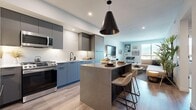 This well-appointed 2-bedroom, 1-bathroom residence offers a thoughtfully designed single-floor layout with modern finishes throughout. The open-concept kitchen and living area serves as the heart of the home, where a striking stone-topped island with seating anchors the kitchen beneath a bold black conical pendant light. The kitchen is equipped with stainless steel appliances, sleek two-tone cabinetry in blue-gray and dark charcoal, under-cabinet lighting, and wood-look flooring that flows seamlessly into the living area. The living room benefits from a large window framing outdoor mountain views, filling the space with natural light and providing an airy, open ambiance. Both bedrooms feature plush carpeting, bright white walls, and windows that invite natural light. The primary bedroom includes a walk-in closet with built-in shelving, offering practical storage. The full bathroom is finished with a wide gray double vanity, a large mirror, built-in wall niches, and a shower-tub combination, all complemented by wood-look tile flooring. A hallway connects the bedrooms and bathroom, completing the efficient and cohesive floor plan. The overall design balances contemporary style with functional living.