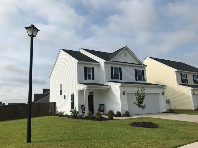 Building Photo - Corner Lot with Fenced in Yard!