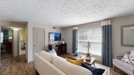 Located at 3312 Keithshire Way in Lexington, Kentucky, this single-floor residence offers a thoughtfully designed layout that balances comfort and functionality. The living room serves as the heart of the home, featuring warm wood-look flooring, a textured ceiling, and large windows dressed with patterned curtains and horizontal blinds that invite generous natural light into the space.

The kitchen is outfitted with crisp white cabinetry, granite-style countertops, a stainless steel refrigerator, dishwasher, and a undermount sink — creating a clean, modern aesthetic that is both practical and visually appealing.

The two bedrooms each carry their own distinct character. The primary bedroom features a calming blue accent wall, plush carpeting, a ceiling fan, and windows with light-filtering blinds. The second bedroom makes a bold statement with a vibrant yellow accent wall, carpeted flooring, a ceiling fan, and ample natural light, lending the room an energetic and welcoming feel.

The bathroom is finished with granite-topped white vanity cabinetry, wood-look tile flooring, and a tiled tub-shower combination. Throughout the residence, a cohesive neutral color palette is complemented by thoughtful accent colors, creating a warm and inviting atmosphere from room to room.