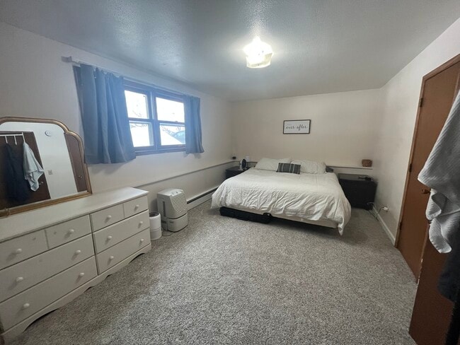 Large bedroom (downstairs) - 4995 Tyler St NE