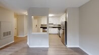 Located at 1030 Atlas Rd in Columbia, SC, this single-floor, 2-bedroom, 1-bathroom home offers a thoughtfully designed layout that makes efficient use of its space. The kitchen is a standout feature, boasting crisp white shaker-style cabinetry, dark countertops, light wood-look luxury vinyl flooring, and a full suite of stainless steel appliances including a refrigerator, range, dishwasher, and built-in microwave hood. A pass-through peninsula connects the kitchen to the adjoining living area, enhancing the open flow of the home.

Both bedrooms are carpeted and painted in neutral tones, lending a calm and comfortable atmosphere. The primary bedroom is generously sized, featuring a ceiling fan with light fixture, dual windows that invite natural light and greenery views, and convenient access to a dedicated closet. The second bedroom also offers carpet flooring, a ceiling fan, and its own window with outdoor views.

The bathroom is functionally designed with light wood-look flooring, a combined tub and shower, and accessibility-friendly grab bars installed along the walls. Classic six-panel interior doors are found throughout the home, complemented by clean white trim and neutral wall colors that create a cohesive, move-in-ready aesthetic throughout.