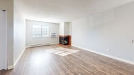 Located at 960 S Dexter St in Denver, Colorado, this single-floor residence offers a practical and comfortable layout with one bedroom, two bathrooms, a den, and dedicated laundry — all within a efficiently designed footprint. The living room serves as the centerpiece of the home, featuring warm wood-style flooring that flows throughout the main areas, a textured ceiling, and a striking corner fireplace with red tile surround and a chevron-patterned surround panel that adds a distinctive design touch. Natural light streams in through multiple windows, brightening the open feel of the space. The bedroom is carpeted for comfort, equipped with a ceiling fan, and offers generous closet storage via dual sliding-door closets. The two bathrooms are clean and functional, with wood-style flooring, white cabinetry, and a full tub-shower combination. Three closets throughout the unit provide ample storage. A dedicated den adds flexible space suitable for a home office or additional living area. The kitchen connects conveniently to the main living areas, and an in-unit laundry room adds everyday convenience. Baseboard heating is present throughout, ensuring year-round comfort in this well-appointed Denver residence.