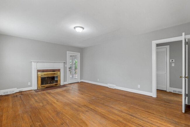 Building Photo - Brick home, Two Story, Hardwoods, 4 Bed Plus 2 Sun Rooms, DR, FP, Carport!.