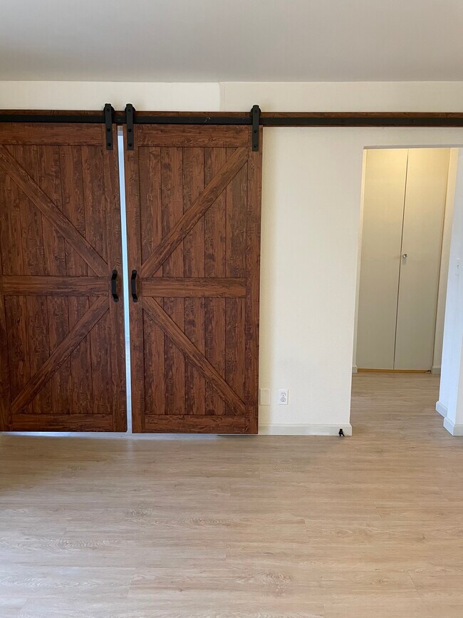 Brand new barnyard doors makes studio into a 1 bedroom for privacy - 368 Imperial Way