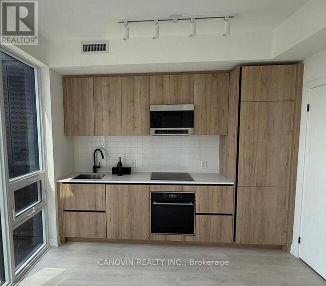 Photo du bâtiment - 117-3117 Broadway Ave