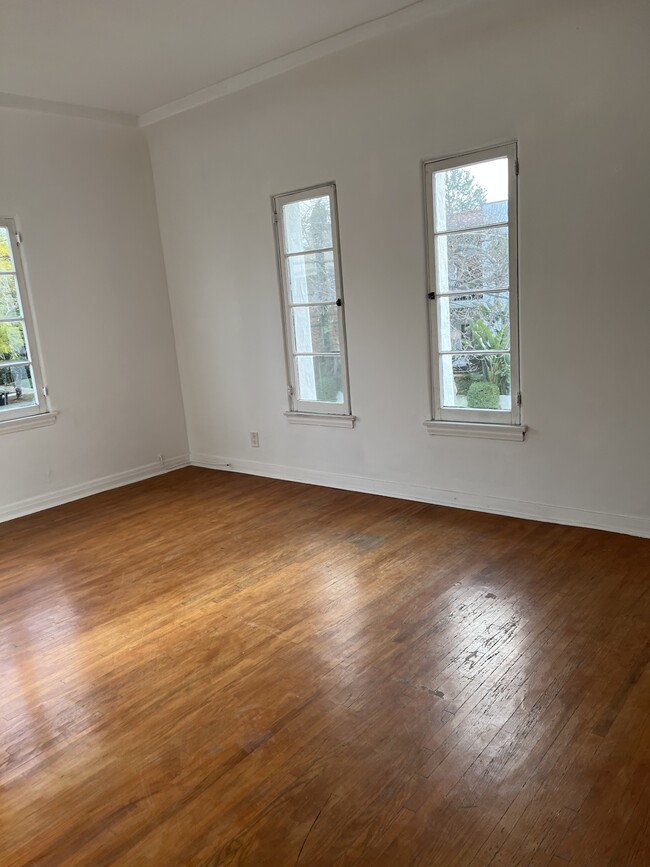 LIVING ROOM WITH VIEWS OF HOLLYWOOD HILLS - 709 N Harper Ave