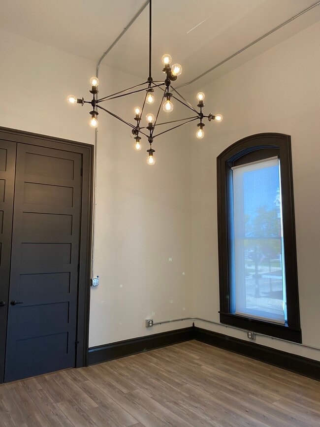 15' ceilings, huge windows, 10' double doors to bedroom. - 102 S Main St