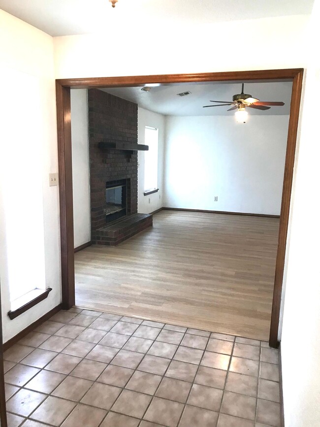 Living with log fireplace - 13201 S 86th East Ave