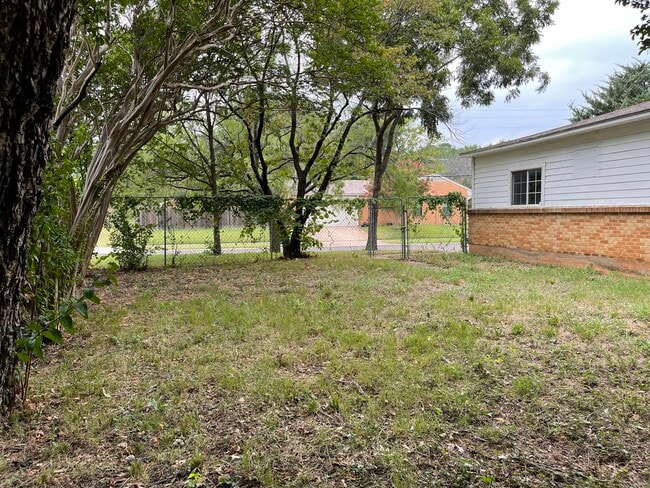 Backyard open area. - 102 E Ireland Dr