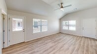 Located at 3705 W Mississippi Ave in Chickasha, Oklahoma, this single-story home offers four bedrooms, two bathrooms, a garage, and a dedicated laundry room within a thoughtfully designed floor plan. Light-toned luxury vinyl plank flooring runs throughout, creating a clean, cohesive look across every room.

The open-concept living room greets you with vaulted ceilings, a ceiling fan, and multiple windows fitted with blinds that flood the space with natural light. It flows seamlessly into the kitchen and dining area, where white shaker-style cabinetry, granite countertops, a large peninsula with an integrated sink, and a full suite of stainless steel appliances — including a refrigerator, range, and microwave — make for a highly functional and attractive space.

Each of the four bedrooms is well-proportioned, featuring ceiling fans, neutral walls, and windows that invite natural light. The spacious primary bedroom includes vaulted ceilings, adding an airy quality to the room. The bathrooms are finished with granite-topped vanities, white cabinetry, and a tub-shower combination. The laundry room provides added convenience with washer and dryer hookups. The attached garage includes a water heater and offers practical utility storage space.