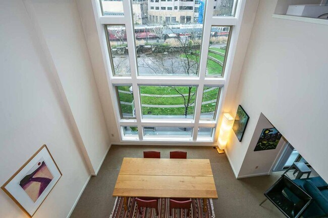 Foto del edificio - Gorgeous loft-style 2 floor condo with secured parking, A/C and rent includes most utilities!