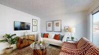 Located at 3221 W El Camino Dr in Phoenix, AZ, this single-story, one-bedroom, one-bathroom residence offers a thoughtfully organized layout across a compact yet efficient floor plan. The living room serves as the heart of the home, featuring wood-look flooring, a textured ceiling, and a sliding glass door that opens to a private patio, filling the space with natural light and outdoor views of mature trees. An adjacent dining area provides a cozy nook for meals, positioned conveniently near the kitchen pass-through. The galley-style kitchen is equipped with ample white cabinetry, a double-basin sink, and black appliances, including a refrigerator and range, all set over easy-care flooring. The bedroom offers a comfortable retreat with a textured ceiling, a window with blinds, and direct access to a dedicated walk-in closet with dual hanging rods. Two additional closets provide generous storage throughout the unit. The bathroom features a clean, bright design with a combination tub and shower, a single vanity, and wood-look tile flooring. A hallway connects the main living spaces efficiently. The consistent wood-look flooring and neutral color palette throughout create a cohesive and inviting ambiance.