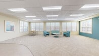 Located at 88 Oldfield Dr in Charlottesville, Virginia, this single-floor community lounge offers a well-appointed and versatile gathering space. The open layout is defined by a neutral-toned patterned carpet throughout, a drop-panel ceiling with recessed and flush-mounted fluorescent lighting, and warm beige walls accented by a bold teal feature wall that adds a pop of color and visual interest.

Natural light pours in through an extensive array of large, multi-pane windows lining the perimeter, offering views of the surrounding outdoor area and creating a bright, airy ambiance. The space is organized into distinct functional zones: a casual lounge area furnished with teal upholstered chairs and a loveseat arranged around a round pedestal coffee table, a smaller dining nook with a round wood table and chairs, and a media area anchored by a wall-mounted flat-screen television.

The entry area features a teal accent wall with framed artwork and a narrow console table, transitioning smoothly into the main space via glass-paneled doors. Additional interior doors provide access to adjacent rooms. The overall design strikes a balance between comfort and functionality, making it a well-suited space for social gatherings, meetings, or quiet relaxation.