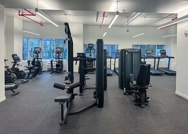 Energize your routine in our cutting-edge fitness center - Newport Rentals