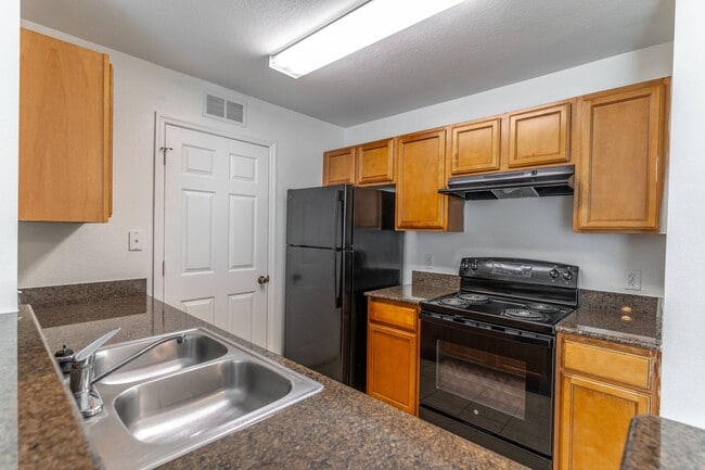 Kitchen with Granite Countertops - Malabar Cove Apartments