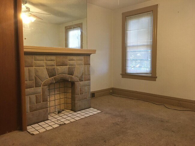 Living room with masonry fireplace & Ceiling Fan - 212 McKinley Ave