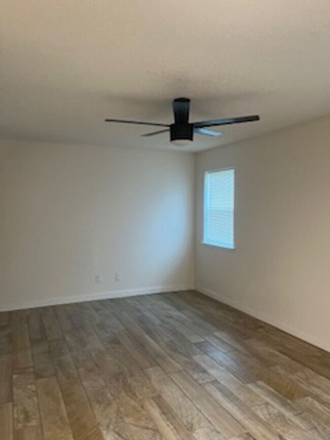 Building Photo - Newly updated with Fresh Paint/Flooring and Appliances