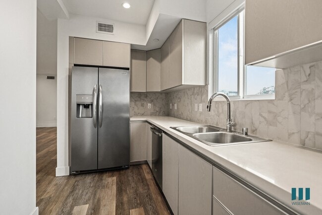 Kitchen with Stainless-Steel Refrigerator, Dishwasher, Stove, and Microwave Oven - Fox Eight by Wiseman
