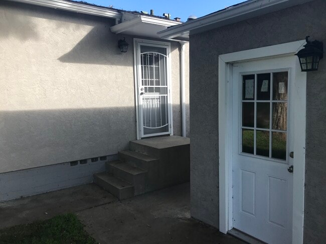 Back of garage and back door - 6980 Adams Ave
