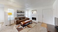 This single-story, two-bedroom, two-bathroom home in Wichita Falls, TX offers a well-organized layout designed for comfortable everyday living. The inviting living room serves as the heart of the home, featuring a classic white brick wood-burning fireplace, neutral carpet, and windows that bring in natural light. Adjacent to the living area, the galley-style kitchen is outfitted with white cabinetry, light countertops, a double sink, and hardwood-style flooring, providing a clean and functional cooking space. The separate dining room offers a bright and open setting with a window overlooking the surrounding landscape. The spacious primary bedroom includes a ceiling fan, carpeted floors, and ample room for furnishings, while the second bedroom also features carpet and a window with natural light. Each bedroom benefits from dedicated closet space. The two bathrooms are well-appointed with shower-tub combinations, white vanities, and easy-to-maintain finishes. A connecting hallway ties the private quarters together seamlessly. Textured ceilings are consistent throughout, contributing to the home's classic character. Located near Weeks Park, this residence offers convenient access to green space and community amenities.