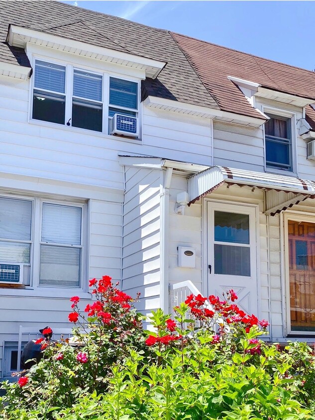 House front, separate entrance to basement - 1674 71st St