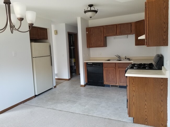 New flooring recently installed in kitchen, entry way, and bathroom! - 391 S Collins St